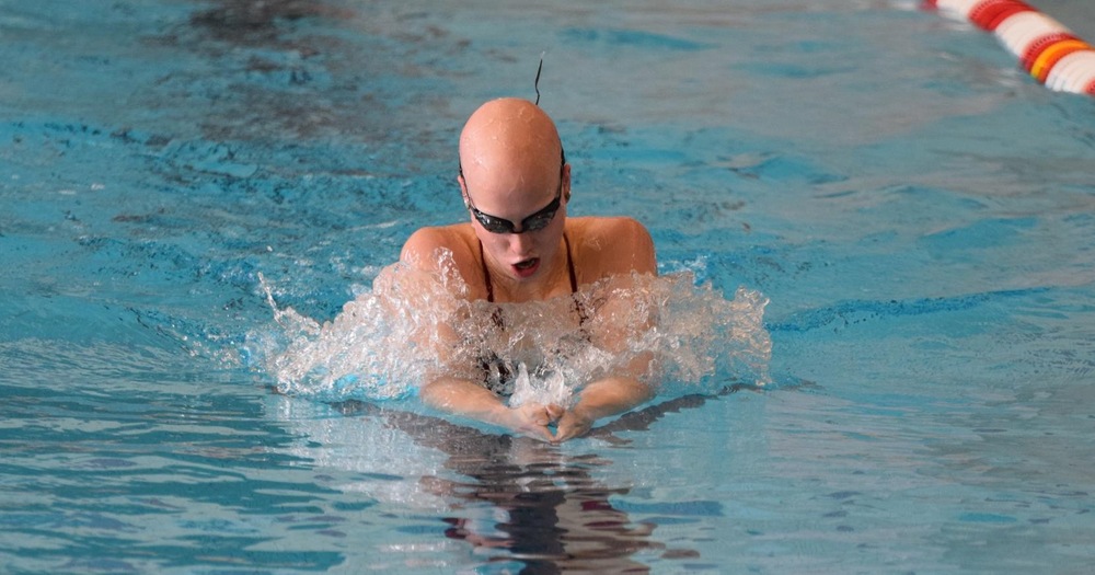 women's swimmer doing breaststroke