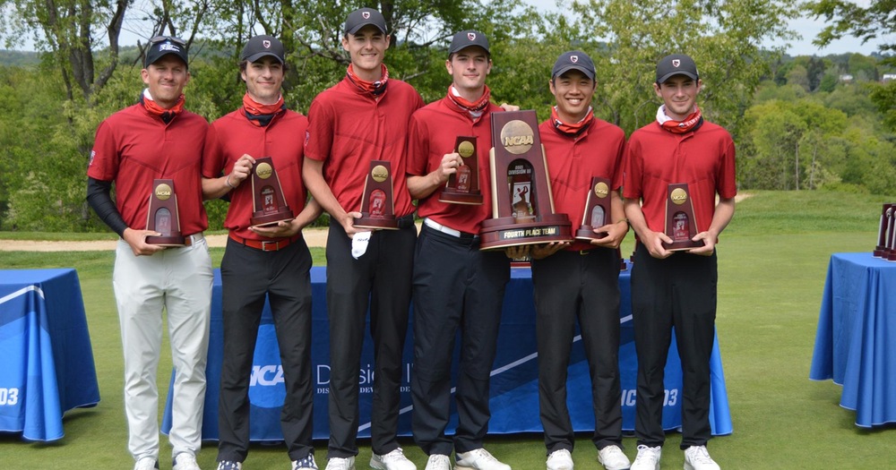 five men's golfers with a male coach standing with NCAA championship trophies