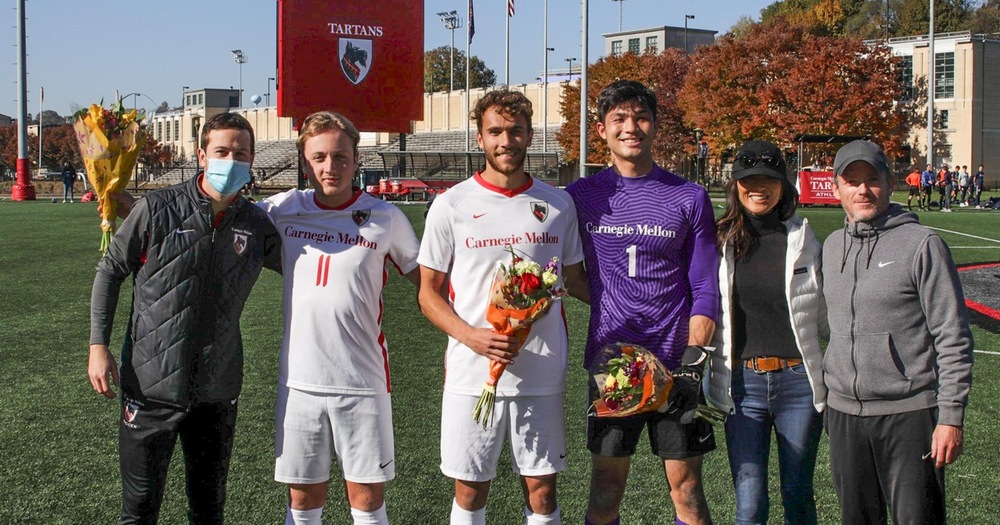 group image of five men and one women posing in celebration of senior day