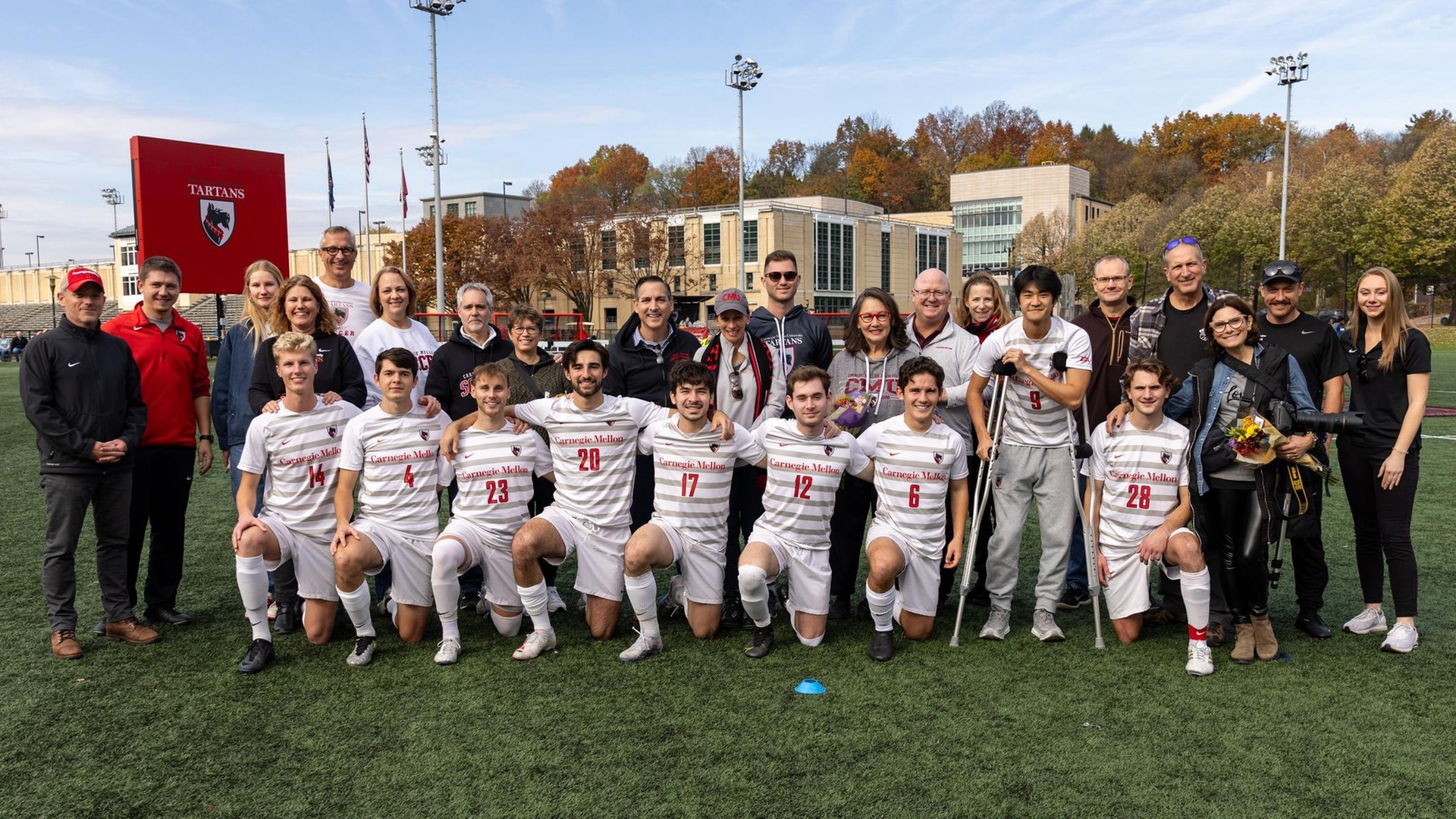 group picture of men's soccer team with families