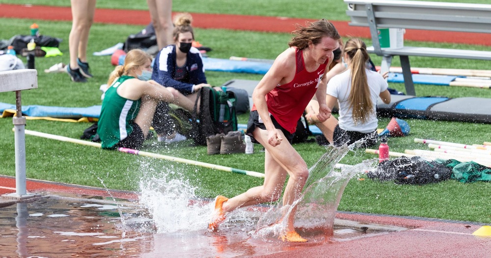 runner coming out of the steeplechase water hole