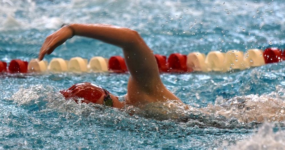 women's swimmer doing freestyle