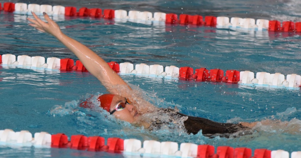women's swimmer doing backstroke