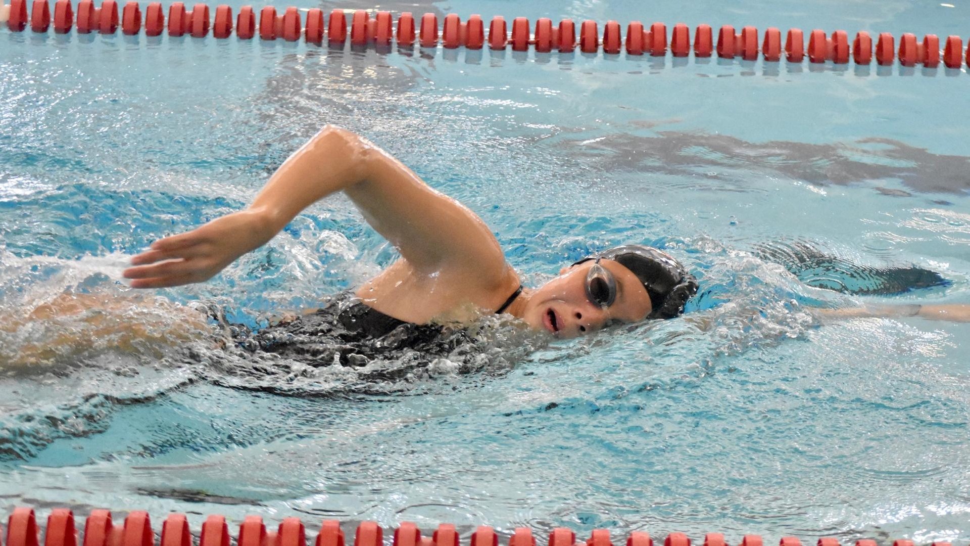 women's swimmer doing freestyle stroke