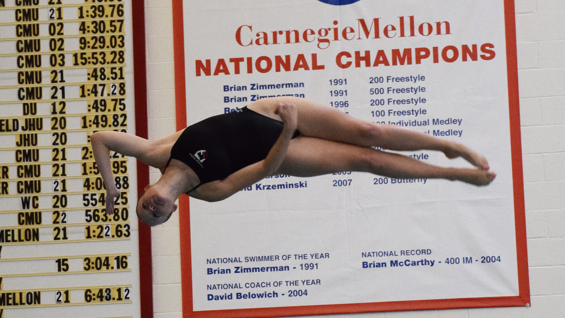 women's diver in horizontal position in air