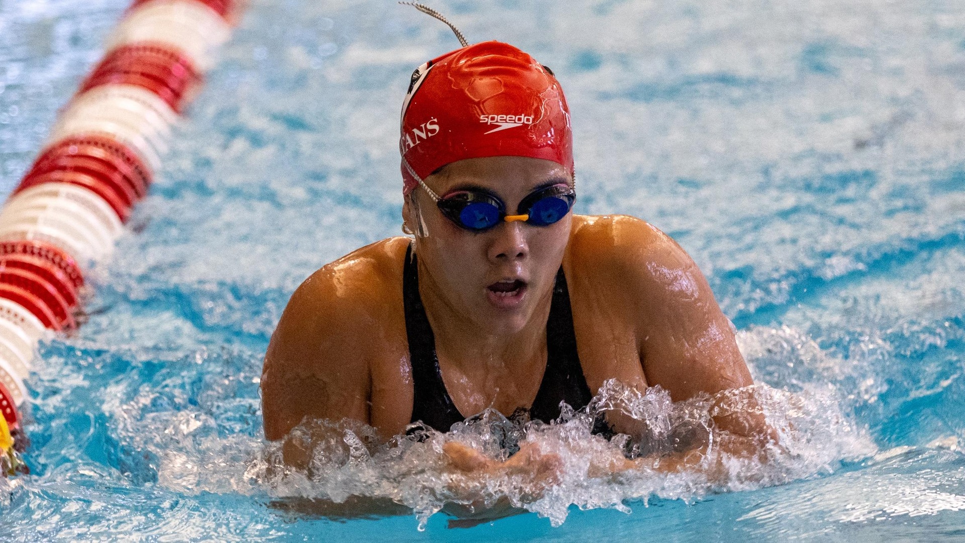 women's swimmer doing breaststroke event