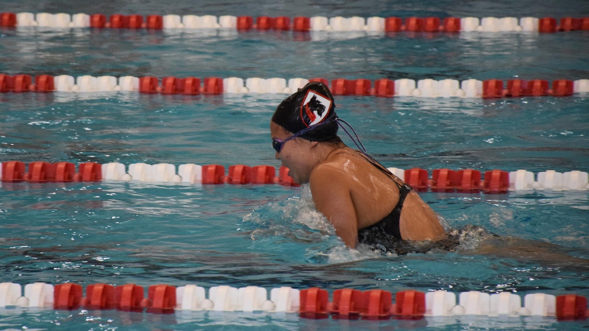 a woman swimming the breaststroke